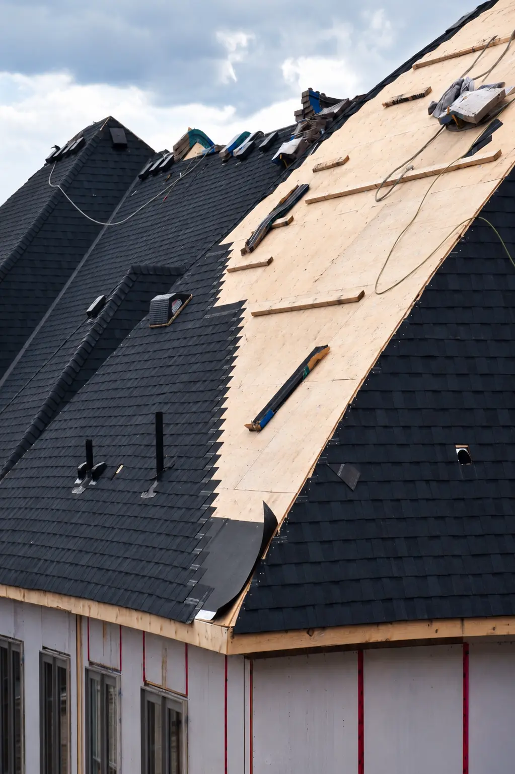 Residential roofing crew working on a home